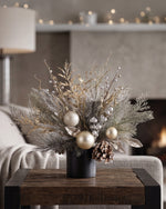 Champagne Elegance Artificial Holiday Accent in Ceramic Cylinder Vase, on a wooden table with cream white decor.