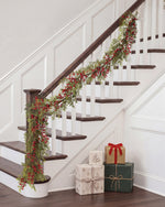 6' Ruscus & Berry Faux Christmas Garland, • 6' Long x 9" Width
 displayed on a staircase rail. 